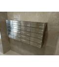 Agrupación de 20 buzones Infinity, de acero color Inox Satinado. Colgados en la pared y con envolvente de acero galvanizado.