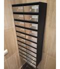 Agrupación de 22 buzones Adapta H3700-05, color Inox Satinado. Colgados en la pared, sin envolvente.