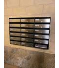 Agrupación de 17 buzones Mira Flat HF8800-05, Inox Satinado. Encastrados en la pared y una bandeja de publicidad