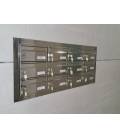 Agrupación de 12 Barajas, inox brillo, empotrados en la pared y con tapajuntas inox brillo.