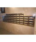  Agrupación de 46 Buzones Moncayo en Acero Inox Brillo, empotrado en pared y con tapajuntas Inox Brillo.