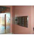 Instalación de SoloBuzones. C.P. Avda. Roces, 1241-1271. Agrupación de 24 buzones Kompact h270 Pintura Inox