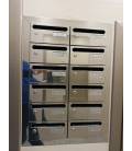 Instalación de SoloBuzones, Hall 20-03212- Inox Brillo AISI 430, Agrupación de 12 buzones, encastrado en la pared y con tapajunt