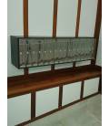 Instalación de SoloBuzones, 1 bloque de 16 buzones Cosmos Push, Negro- Inox Brillo, con envolvente colgados en la pared